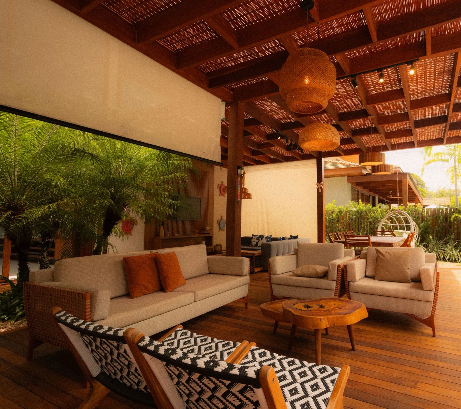 A luxury stone patio with modern outdoor furniture, designed for a West St. Louis County estate home